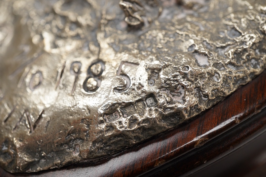 After Tim Nicklin(Kenyan) - A 1980's limited edition silver model of a running ostrich, by Roger John Squires, London, 1986, inscribed 'Tim Nicklin 2/10 1985', on a naturalistic base, fixed to a shaped oval wooden base,